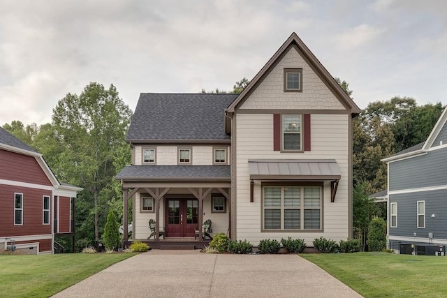 view of front of home with french doors, a porch, and a front yard