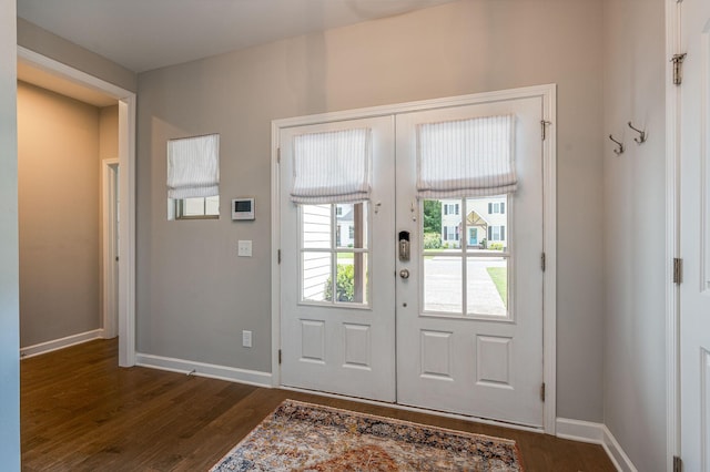 doorway with french doors and dark hardwood / wood-style floors