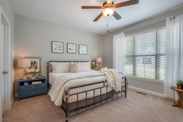 carpeted bedroom featuring ceiling fan