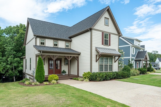 view of front of house with a front yard and a porch