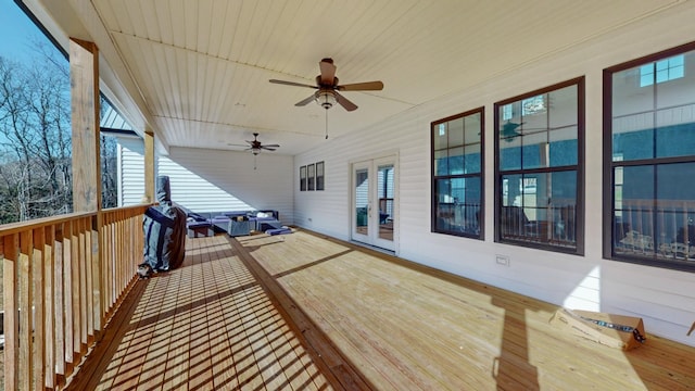 deck featuring grilling area and ceiling fan