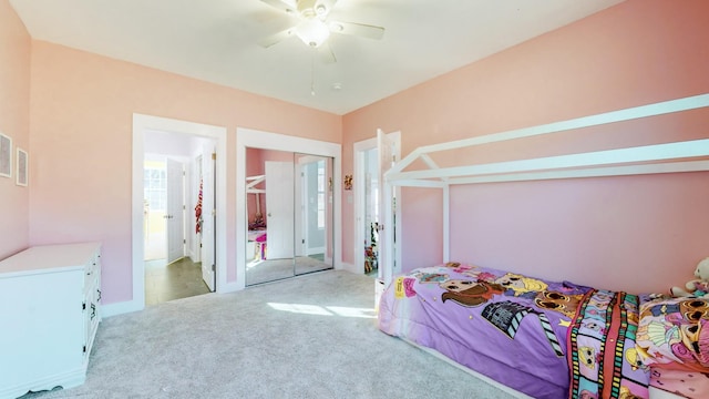 bedroom featuring ceiling fan and light carpet