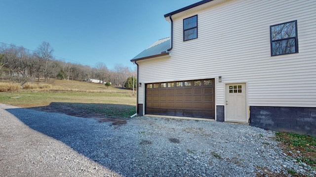 view of property exterior with a garage