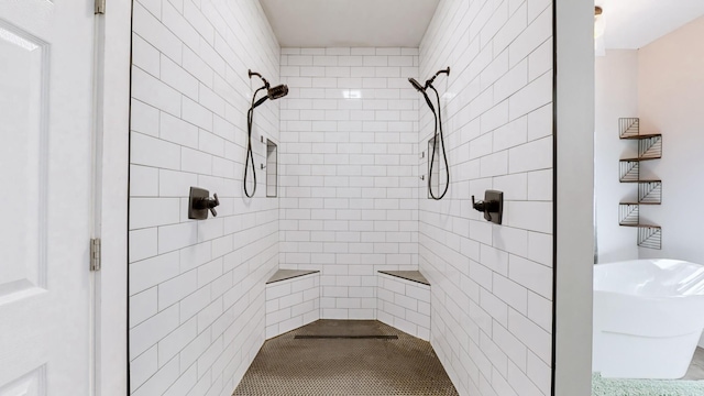 bathroom with a tile shower