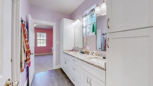 bathroom with vanity and ceiling fan