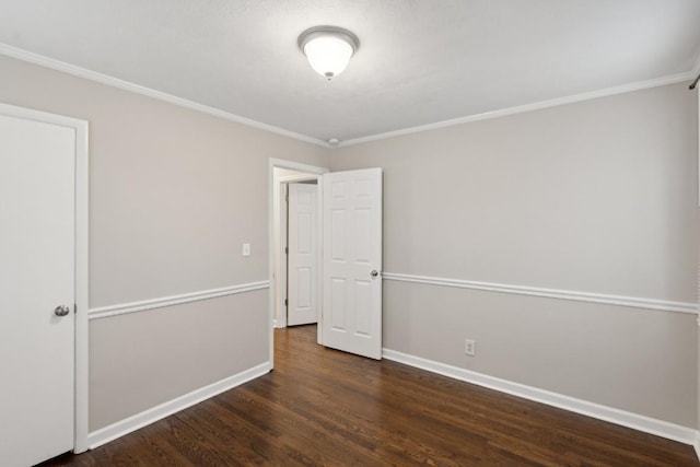 unfurnished room with dark wood-type flooring and ornamental molding