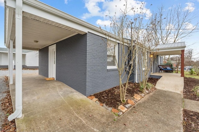 view of side of property featuring a carport