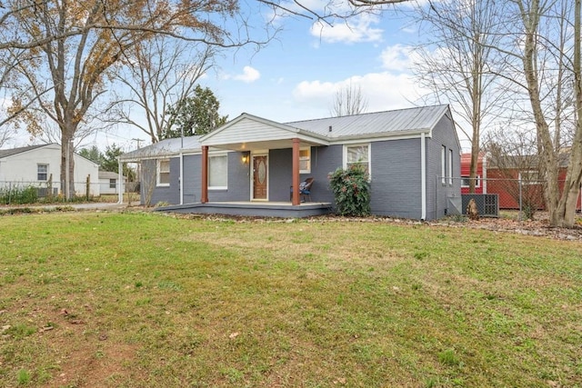 single story home with a porch and a front lawn