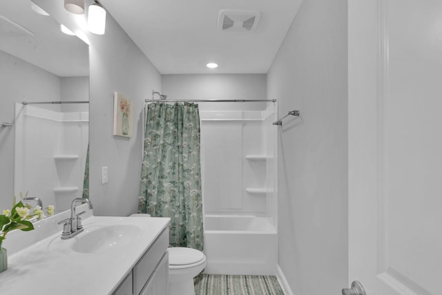 full bathroom with shower / bath combo with shower curtain, vanity, and toilet