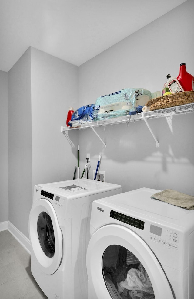 laundry area with independent washer and dryer