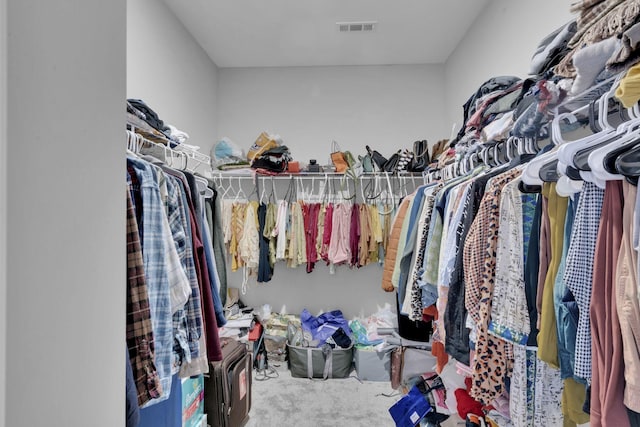 walk in closet featuring carpet floors