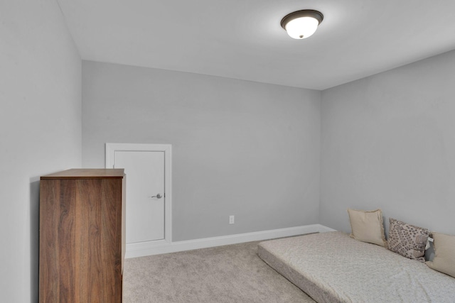 unfurnished bedroom featuring light carpet