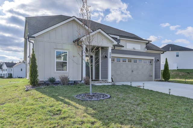 view of front of house with a garage and a front lawn