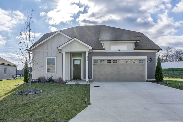 view of front facade with a front yard and a garage