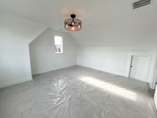 additional living space featuring vaulted ceiling