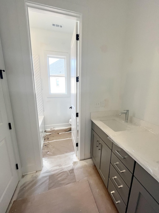 bathroom with vanity and toilet