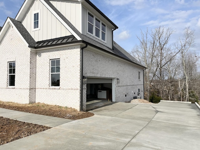 view of side of home with a garage