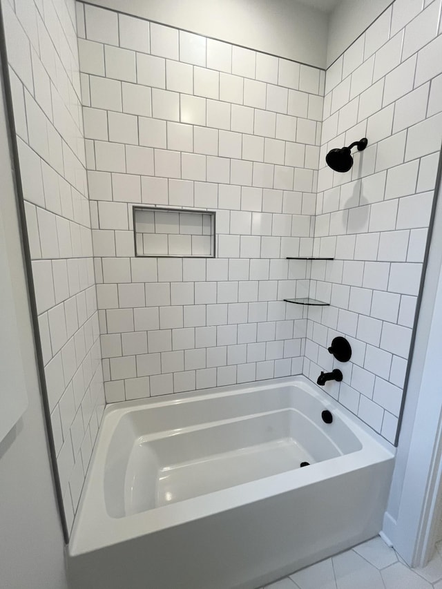 bathroom featuring bathing tub / shower combination and tile patterned floors