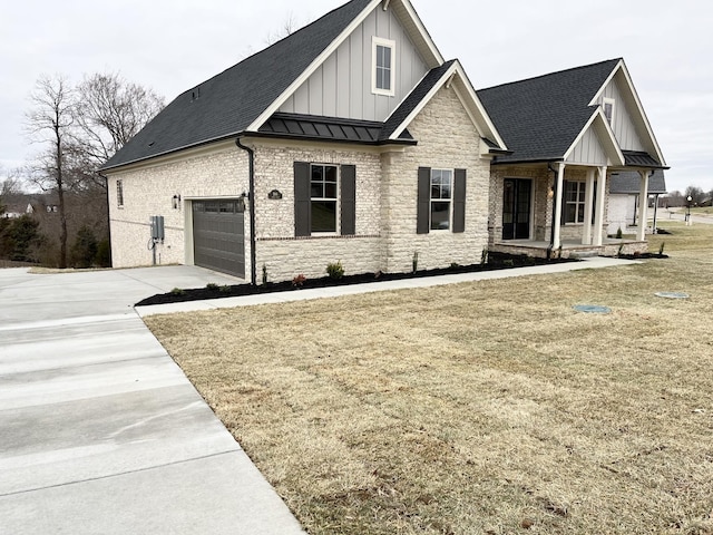 view of front of property featuring driveway, a standing seam roof, metal roof, and board and batten siding