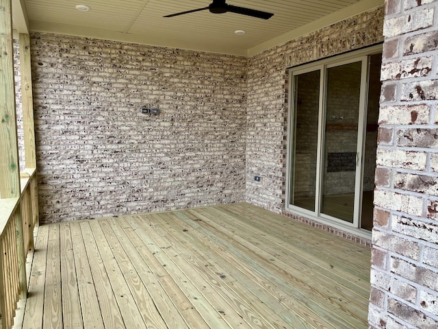 wooden terrace featuring ceiling fan