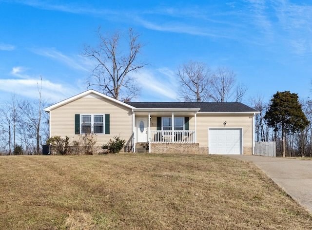 ranch-style home with a garage, covered porch, and a front lawn