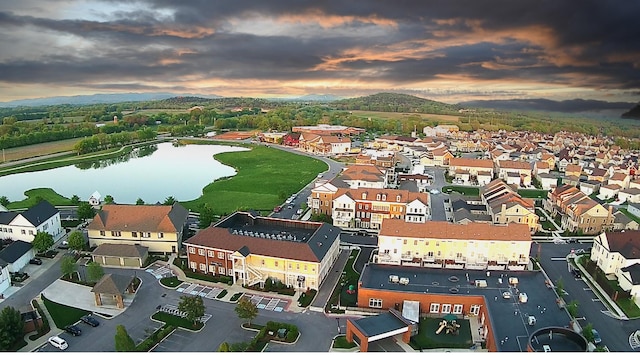 aerial view at dusk with a water view