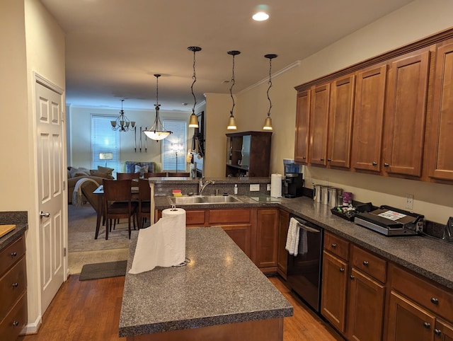 kitchen with dishwasher, a center island, dark wood-type flooring, an inviting chandelier, and sink