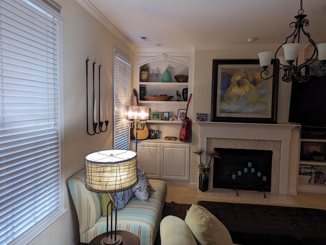 living room with built in shelves, crown molding, and a tile fireplace