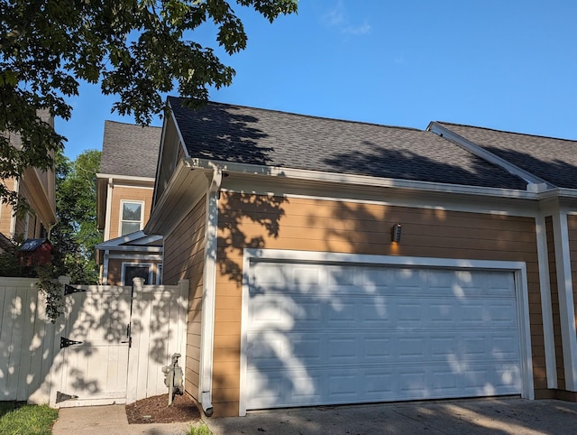 view of side of property with a garage