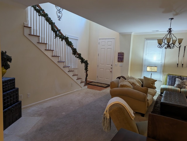 living room featuring crown molding, carpet floors, and a chandelier