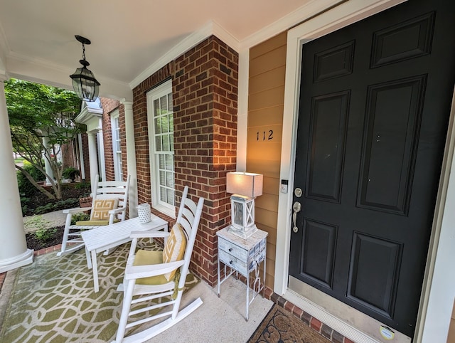 view of exterior entry with a porch