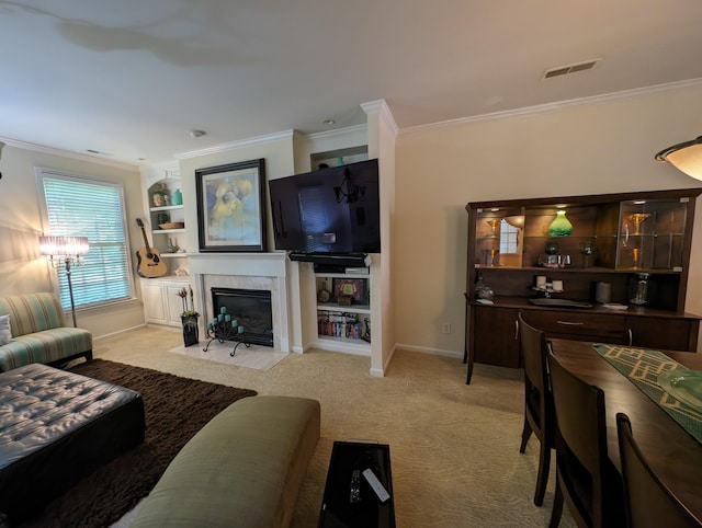 living room with a tile fireplace, light colored carpet, and ornamental molding