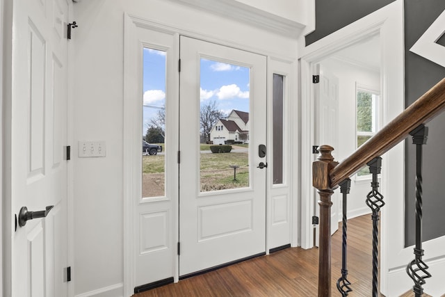 entryway with dark wood-type flooring