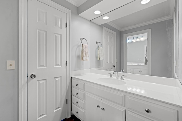 bathroom featuring vanity and crown molding