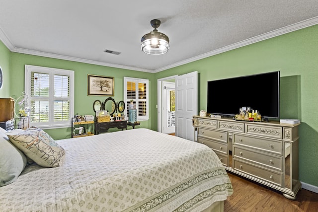 bedroom featuring dark hardwood / wood-style floors and crown molding