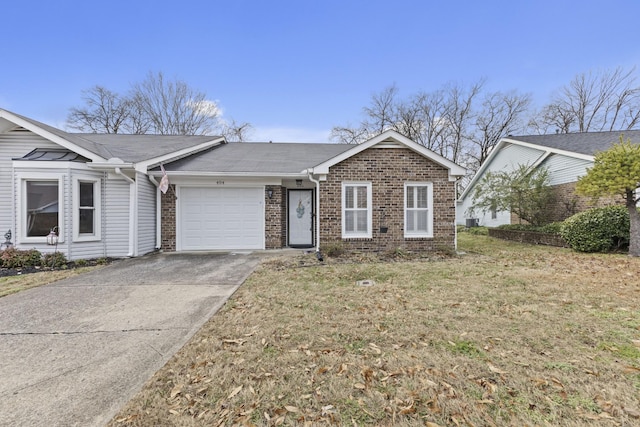 ranch-style house featuring a front lawn and a garage