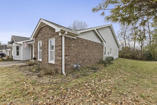 view of property exterior featuring a lawn