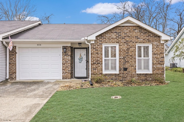 single story home with a garage, central air condition unit, and a front lawn