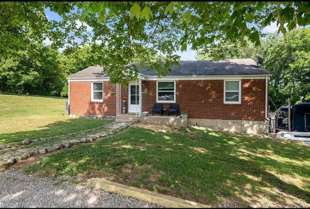 ranch-style house featuring a front lawn