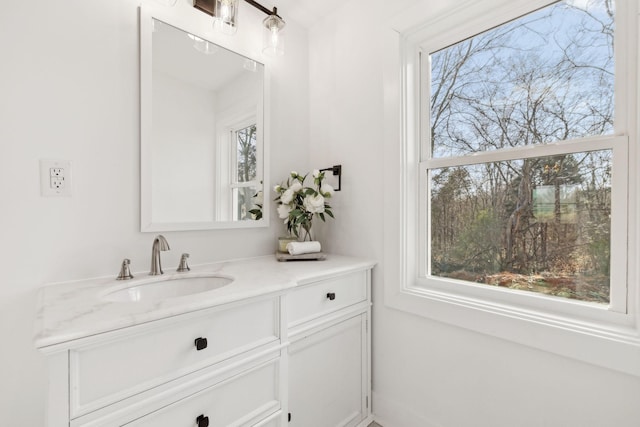 bathroom with a wealth of natural light and vanity