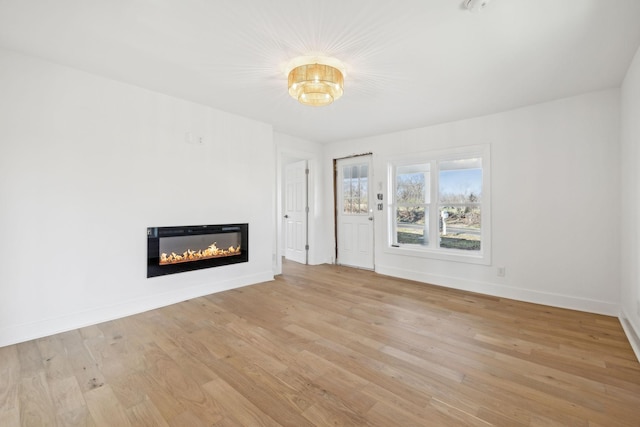 unfurnished living room featuring light hardwood / wood-style flooring