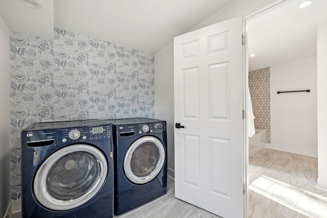 laundry room with washing machine and clothes dryer