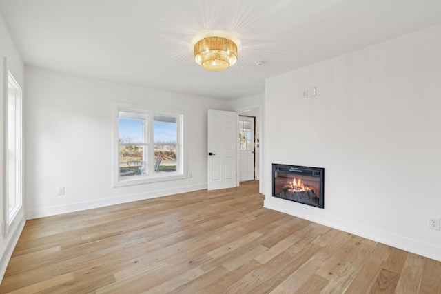 unfurnished living room with light hardwood / wood-style floors