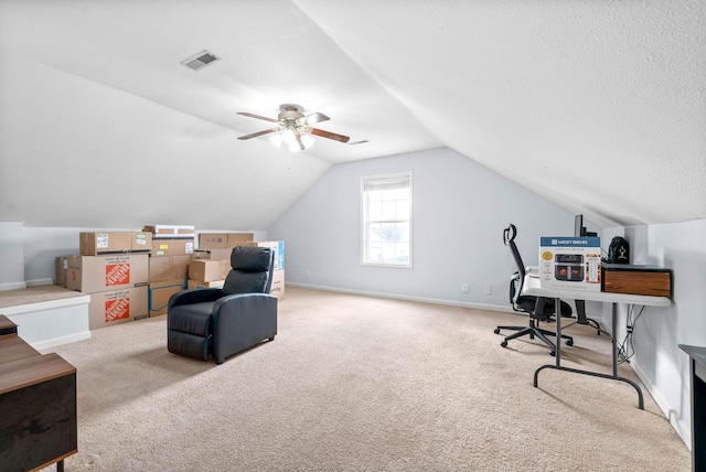 carpeted home office with ceiling fan and lofted ceiling