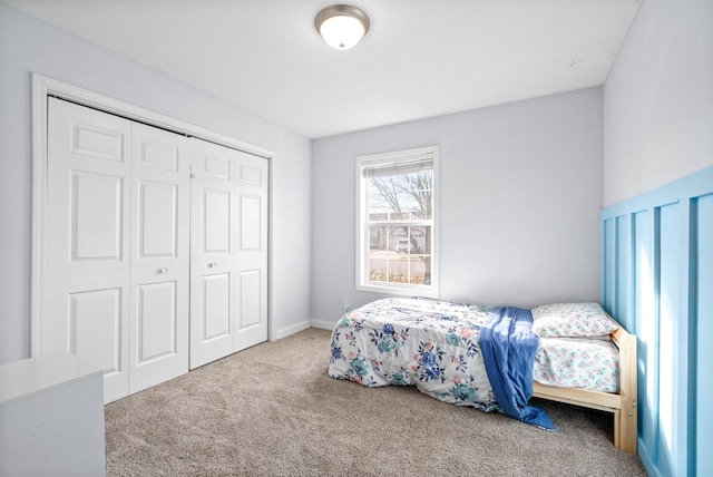 carpeted bedroom featuring a closet