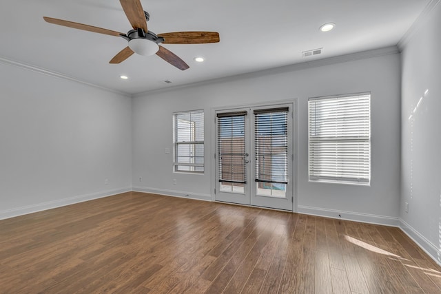 spare room featuring french doors, ceiling fan, ornamental molding, and wood-type flooring