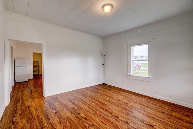 spare room featuring hardwood / wood-style flooring