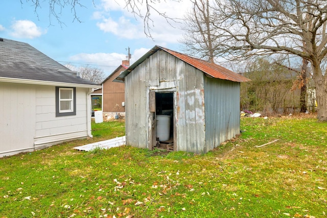 view of outdoor structure with a yard