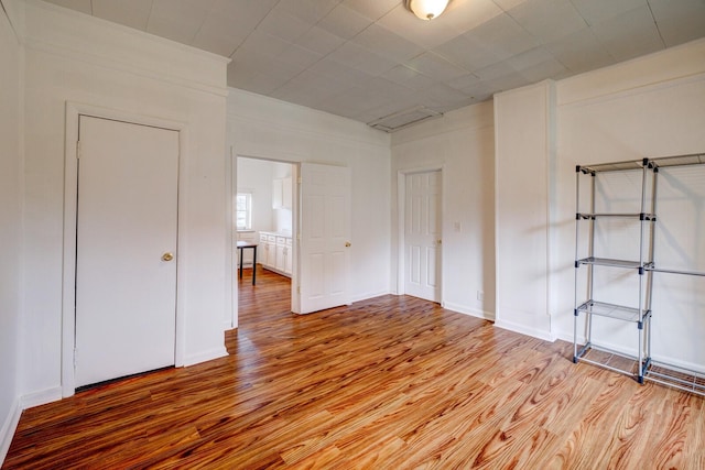 spare room featuring light hardwood / wood-style flooring