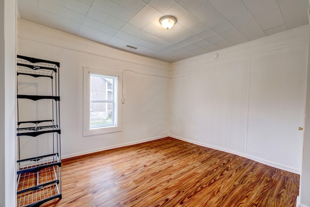 empty room with wood-type flooring